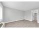 Bedroom featuring wood-look floors, bright natural light, and a large closet at 406 W Cedar St # 403, Tampa, FL 33606
