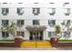 Exterior view of Hyde Park Towers, featuring yellow stairs leading to the entrance at 406 W Cedar St # 403, Tampa, FL 33606