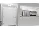 View of entryway with stainless steel appliances in the kitchen area beyond at 406 W Cedar St # 403, Tampa, FL 33606
