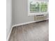 Living room with wood-look flooring and a window with natural light at 406 W Cedar St # 403, Tampa, FL 33606