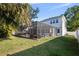 Spacious backyard featuring a large screened in pool area, perfect for outdoor enjoyment and entertaining guests at 4105 W Corona St, Tampa, FL 33629