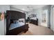Bedroom featuring a bunk bed, carpeted flooring, and a desk area at 4105 W Corona St, Tampa, FL 33629