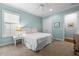 Inviting bedroom with a comfortable bed, soft lighting, and ample closet space at 4105 W Corona St, Tampa, FL 33629
