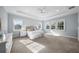 Spacious bedroom featuring natural light, a tray ceiling, and neutral carpet at 4105 W Corona St, Tampa, FL 33629