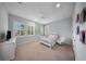 Bright bedroom with big windows, a bed and hanging chair, and a calm vibe at 4105 W Corona St, Tampa, FL 33629