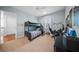 Bedroom featuring a bunk bed, carpeted flooring, and a desk area at 4105 W Corona St, Tampa, FL 33629