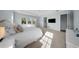 Bright bedroom offers a neutral color scheme, carpet flooring, and large windows at 4105 W Corona St, Tampa, FL 33629