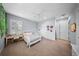 Spacious bedroom with a hanging chair, big windows, and a ceiling fan for comfortable living at 4105 W Corona St, Tampa, FL 33629