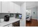 Well-equipped butler's pantry with coffee maker, wine cooler, and ample counter space for seamless entertaining at 4105 W Corona St, Tampa, FL 33629