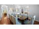 Formal dining room featuring chandelier, hardwood floors, and elegant seating, ideal for gatherings and special occasions at 4105 W Corona St, Tampa, FL 33629