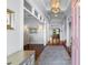 Inviting foyer showcasing hardwood floors, paneled ceiling, and an open view into the living spaces at 4105 W Corona St, Tampa, FL 33629