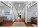 Inviting hallway showcasing hardwood floors, paneled ceilings, and views of multiple rooms, creating an open flow at 4105 W Corona St, Tampa, FL 33629