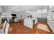Open concept kitchen and living area with hardwood floors, a center island, and ample seating at 4105 W Corona St, Tampa, FL 33629