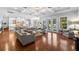 Open concept living area with hardwood floors, coffered ceilings, and seamless flow to outdoor pool at 4105 W Corona St, Tampa, FL 33629