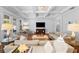 Cozy living room featuring coffered ceilings, large windows, and ample seating for entertaining at 4105 W Corona St, Tampa, FL 33629