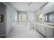 Bright main bathroom with dual vanities, soaking tub and glass shower at 4105 W Corona St, Tampa, FL 33629