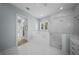 This bright main bathroom features dual vanities, a large soaking tub, and a glass shower at 4105 W Corona St, Tampa, FL 33629