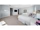This main bedroom features natural light, an ensuite bathroom, and a walk-in closet at 4105 W Corona St, Tampa, FL 33629
