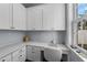 Bright home office features white cabinets, drawers, and a marble countertop by the window at 4105 W Corona St, Tampa, FL 33629