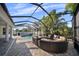 Enclosed patio featuring stylish outdoor seating and pool at 4105 W Corona St, Tampa, FL 33629