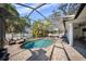 Backyard oasis features a sparkling pool and relaxing patio area, perfect for outdoor enjoyment at 4105 W Corona St, Tampa, FL 33629