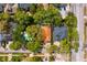 Aerial view of a home surrounded by lush greenery, showcasing the neighborhood layout at 4310 W Sevilla St, Tampa, FL 33629