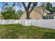 Spacious backyard with a well-kept lawn and a white privacy fence at 4310 W Sevilla St, Tampa, FL 33629