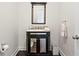 Elegant powder room features a decorative vanity, mirror, marble countertop, and stylish fixtures at 4310 W Sevilla St, Tampa, FL 33629