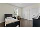 Bedroom with dark floors and a simple, modern design at 4310 W Sevilla St, Tampa, FL 33629
