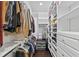 Walk-in closet featuring custom shelving and wooden floors at 4310 W Sevilla St, Tampa, FL 33629