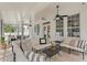 Inviting covered patio with comfortable seating, ceiling fans, and large windows at 4310 W Sevilla St, Tampa, FL 33629