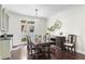 Bright dining room with wood floors, ample lighting, and a full dining set at 4310 W Sevilla St, Tampa, FL 33629