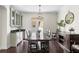 Bright dining room featuring hardwood floors, built-in cabinets, and a large dining table at 4310 W Sevilla St, Tampa, FL 33629