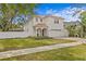 Stunning two-story home with tiled roof, arched portico, and brick paver driveway at 4310 W Sevilla St, Tampa, FL 33629