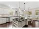 White kitchen with stainless steel appliances and a large island at 4310 W Sevilla St, Tampa, FL 33629