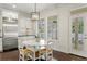 Kitchen nook with a breakfast table and chairs, natural lighting, and a porch view at 4310 W Sevilla St, Tampa, FL 33629