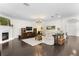 Spacious living room featuring a fireplace, hardwood floors, and stylish decor at 4310 W Sevilla St, Tampa, FL 33629