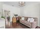 Inviting living area featuring a plush sofa, desk setup, and a view into dining area at 4310 W Sevilla St, Tampa, FL 33629