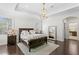 Main bedroom with trey ceilings, two windows and adjacent bathroom at 4310 W Sevilla St, Tampa, FL 33629