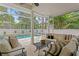 Inviting screened pool area with comfortable seating, perfect for outdoor relaxation and entertaining at 4310 W Sevilla St, Tampa, FL 33629