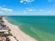 Stunning aerial view of the pristine beach and calm ocean waters at 438 62Nd St, Holmes Beach, FL 34217
