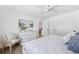 Bright bedroom with coastal decor, ceiling fan, and white dresser at 438 62Nd St, Holmes Beach, FL 34217