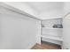 Walk-in closet with built-in shelving and wooden floor at 438 62Nd St, Holmes Beach, FL 34217