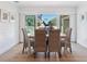 Dining area with wicker chairs, wooden table and sliding glass doors to the exterior at 438 62Nd St, Holmes Beach, FL 34217