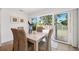 Dining area with white shiplap walls and sliding glass doors to the exterior at 438 62Nd St, Holmes Beach, FL 34217