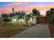 Charming home with manicured lawn, stone driveway, mature landscaping and covered parking at 438 62Nd St, Holmes Beach, FL 34217