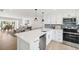 Open-concept kitchen features quartz countertops, stainless steel appliances, and is open to the living area at 438 62Nd St, Holmes Beach, FL 34217