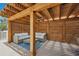 Covered patio area features an outdoor seating set, wood structure and lighting at 438 62Nd St, Holmes Beach, FL 34217
