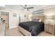 Inviting bedroom featuring neutral tones, a large bed, and access to a bathroom at 440 S Gulfview Blvd # 1701, Clearwater Beach, FL 33767