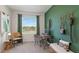 Inviting office space with stylish decor, great natural light, and a calming color palette at 526 Mangrove Shade Cir, Apollo Beach, FL 33572